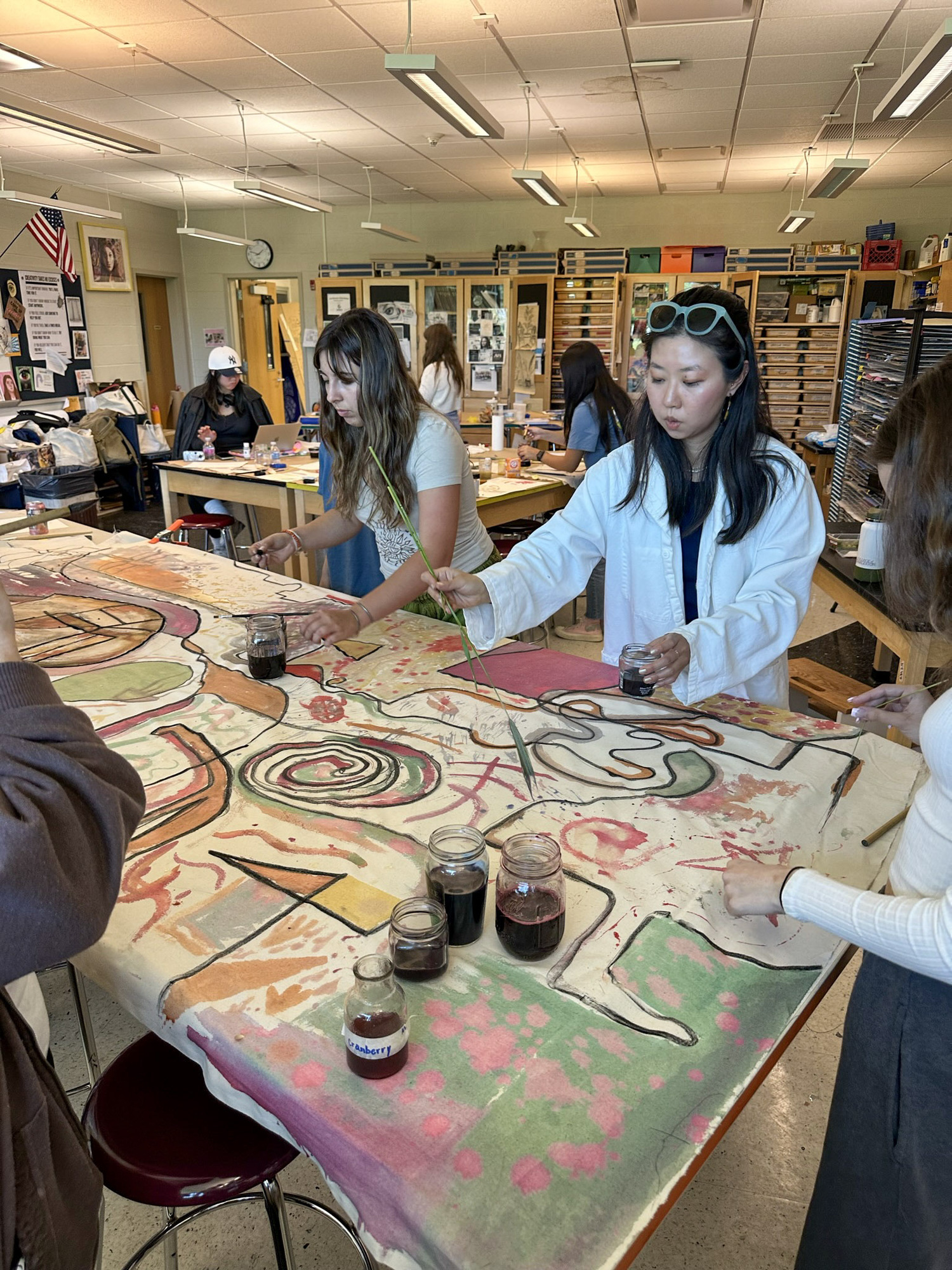 Artist Beau Bree Rhee works with a group of East Hampton High School students on their piece for 