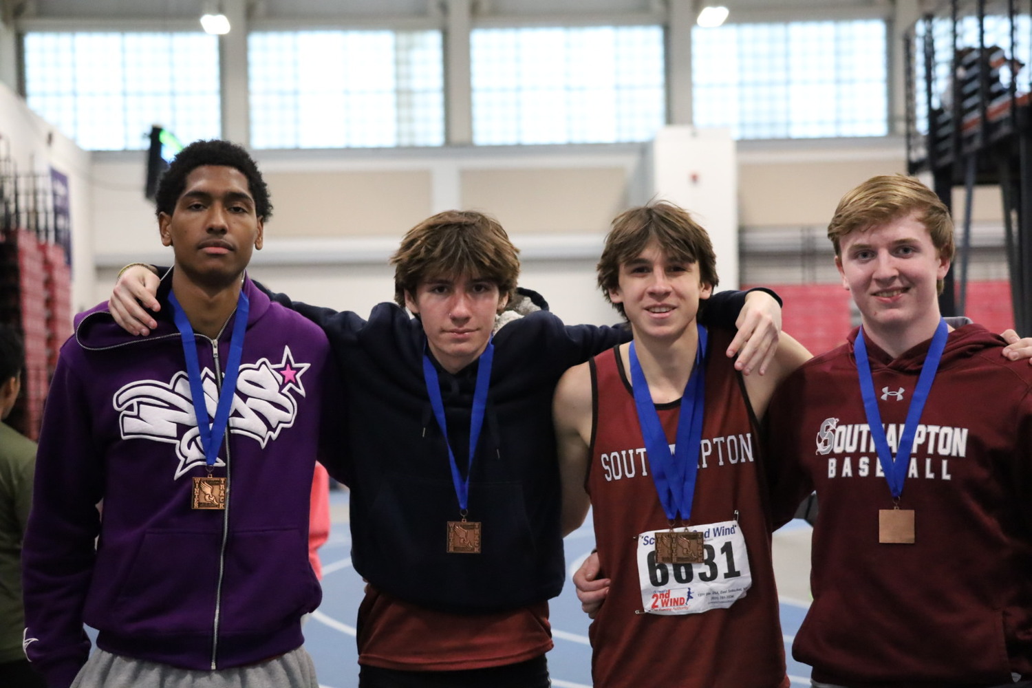 The Southampton boys 4x400-meter relay team of, from left, Tyrese Reddick, Jett De Sane, Tanner Marro and Daniel McDonnell finished fourth at the league championships.   JAMIE CARLSEN-DE SANE