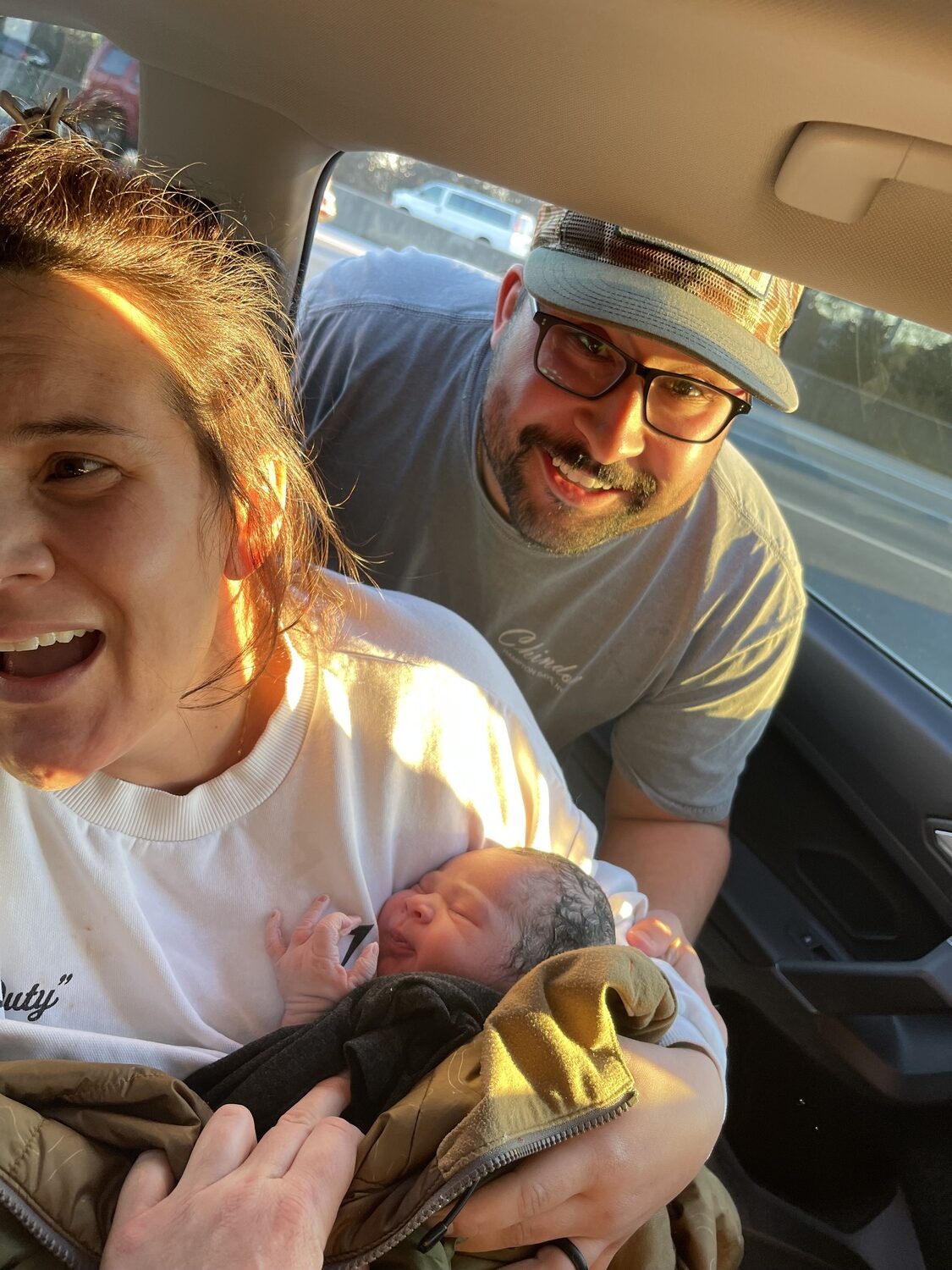 East Quogue resident Ashley Bard, left, and her husband Josh Bard, moments after she delivered their baby boy, Roe Rey Bard, in their car while pulled over on the shoulder of the Long Island Expressway. They had been headed to Stony Brook University Hospital, but Baby Roe made his arrival before they got there.