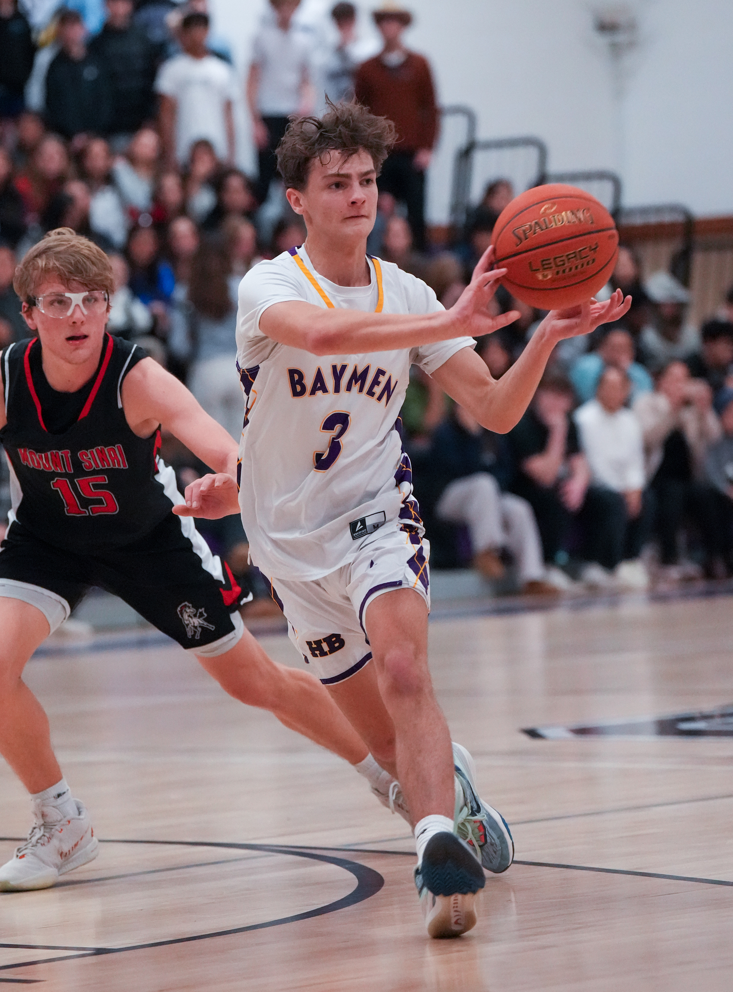 Hampton Bays senior James Powers passes the ball.   RON ESPOSITO