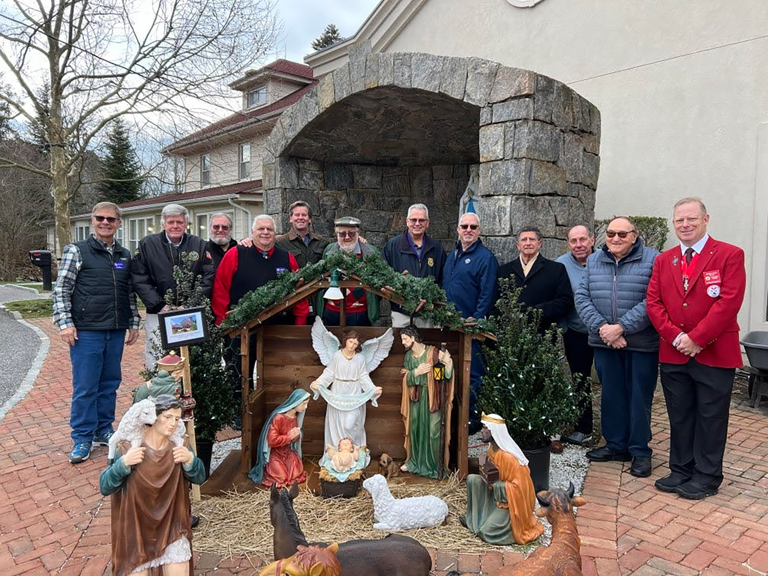 On the Eve of the Epiphany, members of the Knights of Columbus Joseph Slomski Council #7423 of Immaculate Conception Church in Westhampton Beach gathered together behind the new Nativity Scene, acquired through the generosity of members of  our parish. COURTESY KNIGHTS OF COLUMBUS