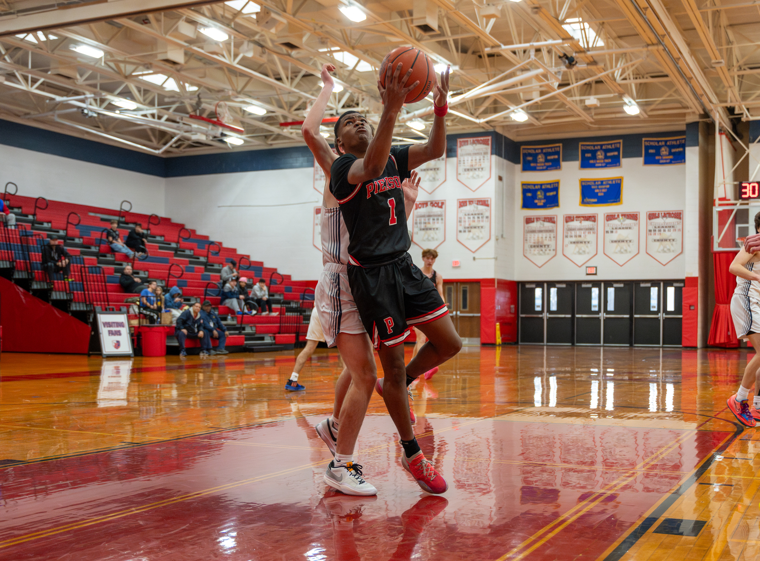 Pierson senior Keanu King goes up and under to score.   RON ESPOSITO