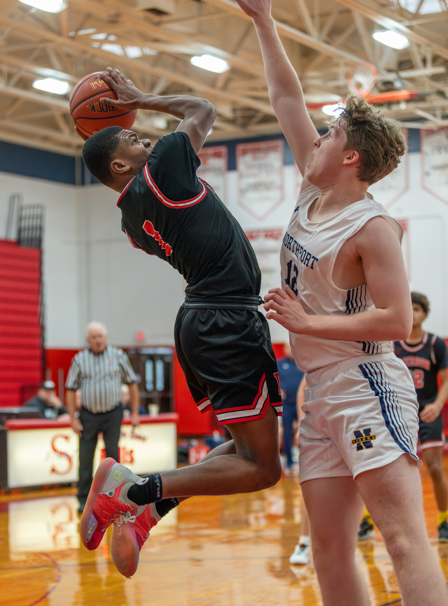 Keanu King takes on Northport's big man.   RON ESPOSITO