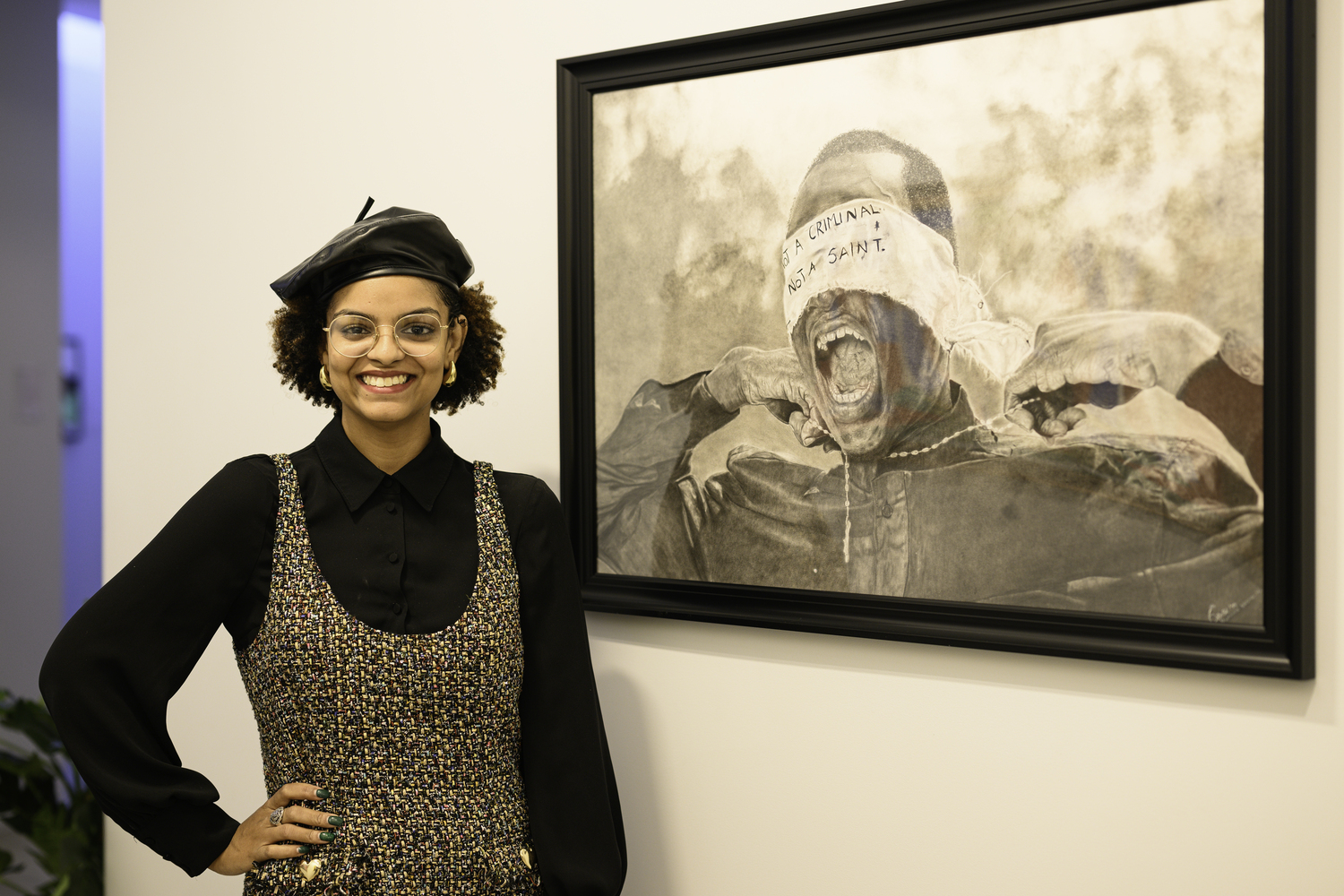 Curator Kilsi Rodriguez Bold with Mayowa Nwadike's work 