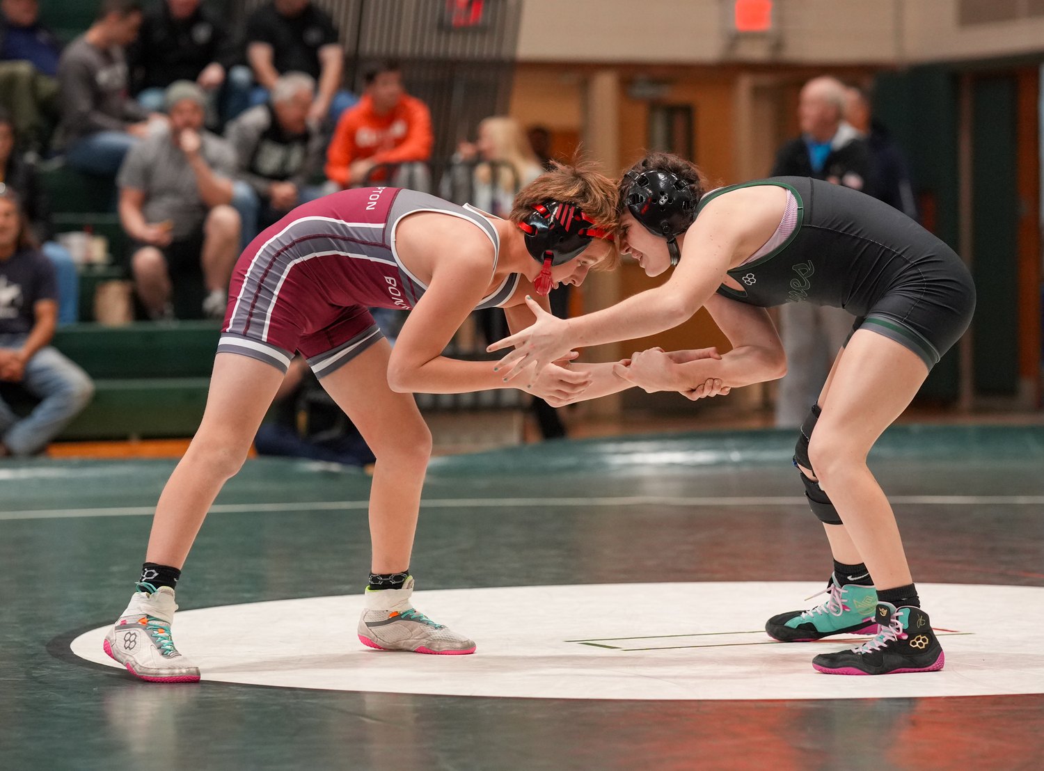 Lily Blenk battles with East Hampton's Caleb Mott. Blenk won in a major decision.  RON ESPOSITO