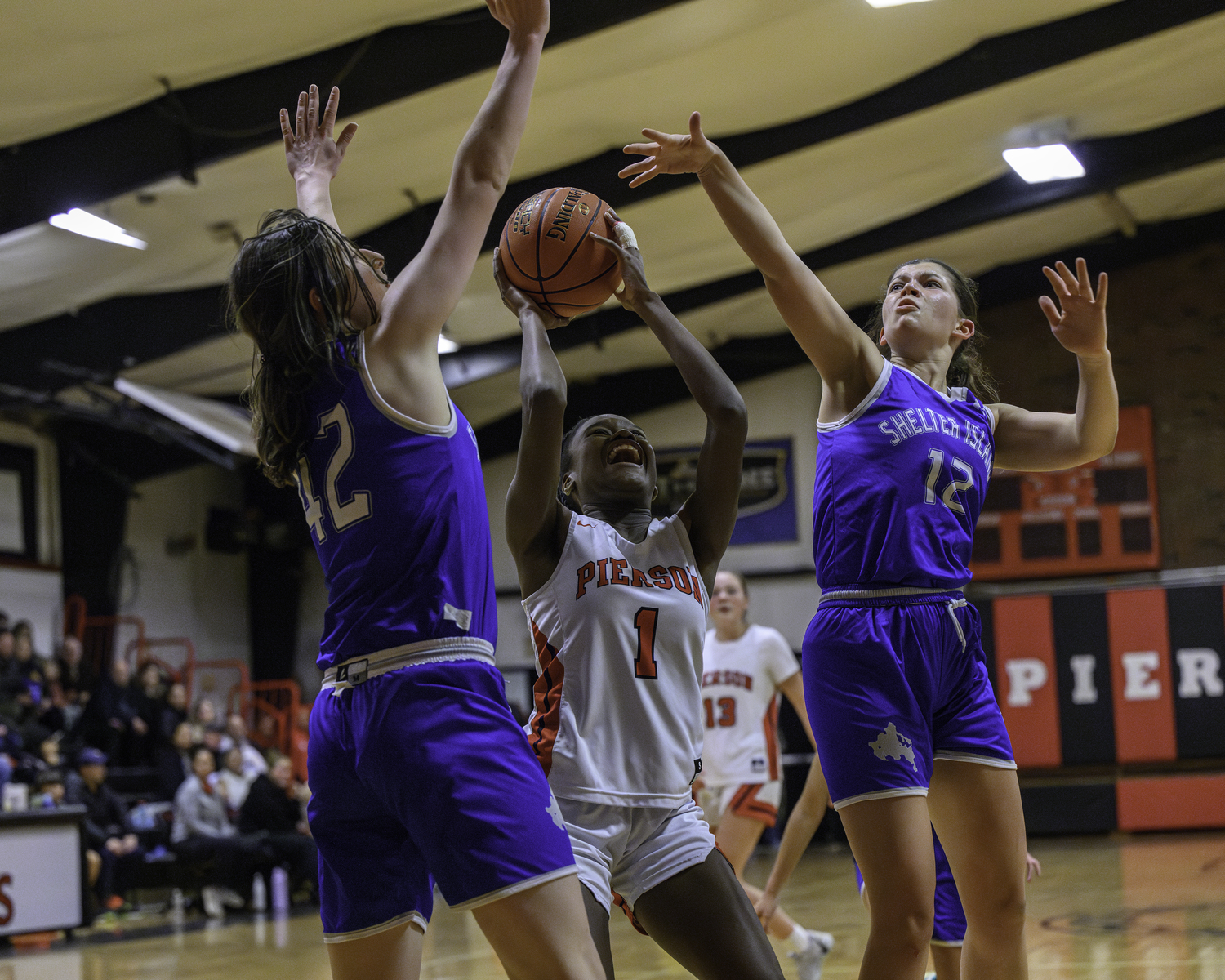 Bridgehampton's Makayla Pinckney battles through a pair of Shelter Island players.   MARIANNE BARNETT