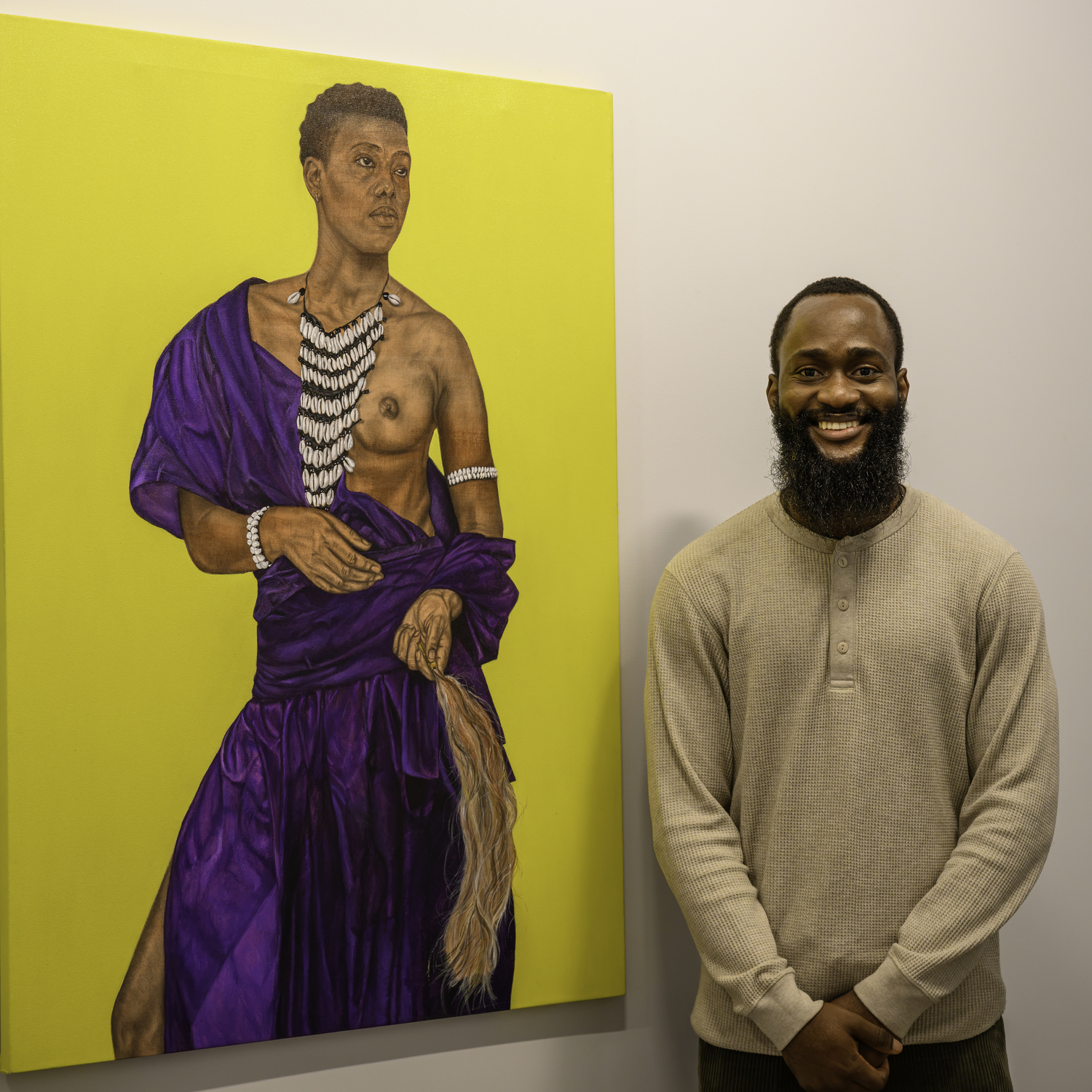 Mayowa Nwadike with his painting 