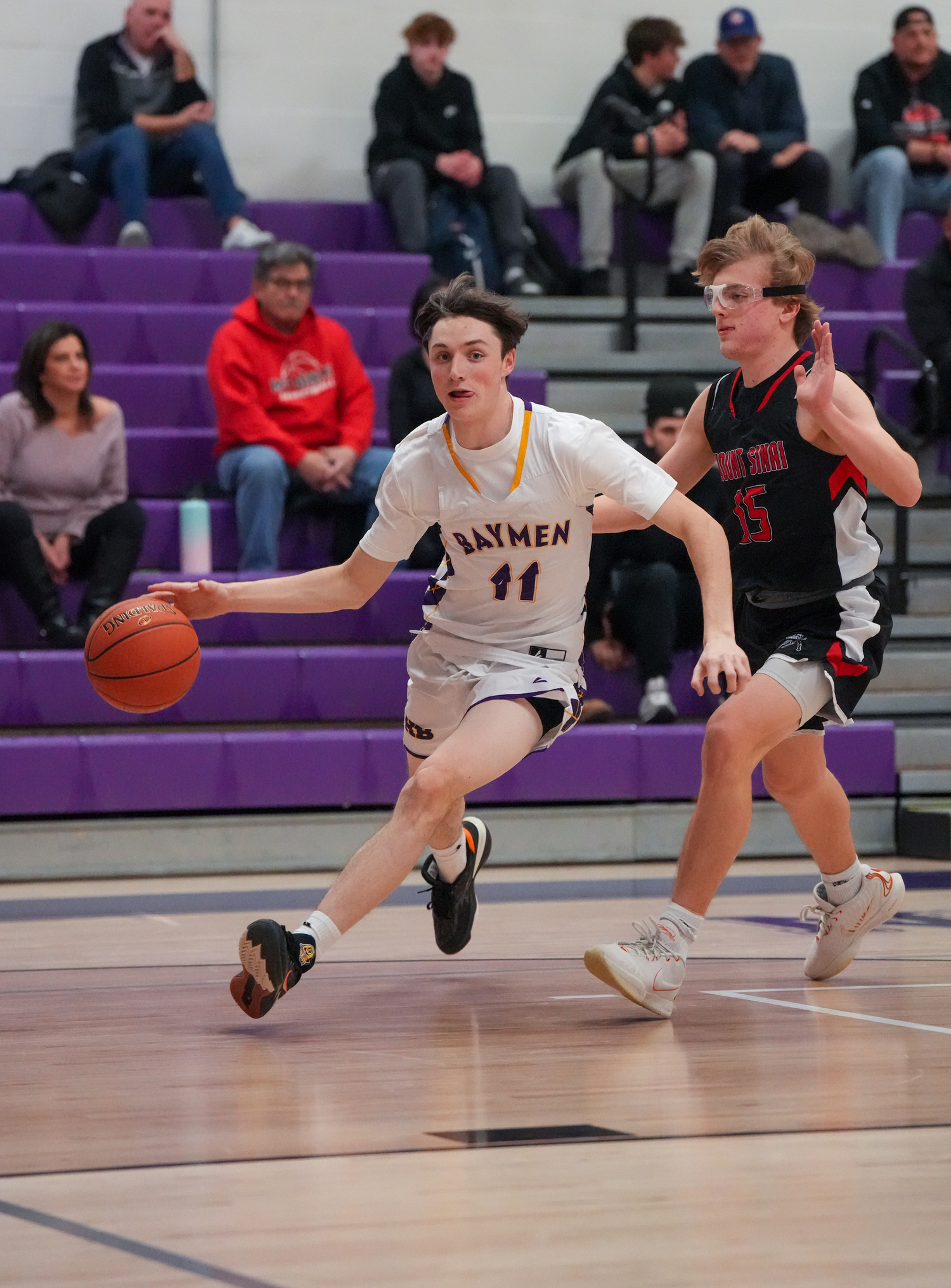 Hampton Bays senior Patrick Donahue dribbles around a Mount Sinai player.   RON ESPOSITO