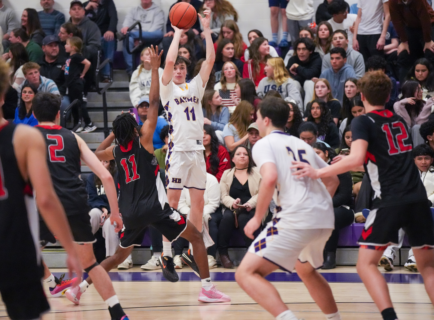 Patrick Donahue makes a three to end a long scoring drought for the Baymen in the third quarter.   RON ESPOSITO