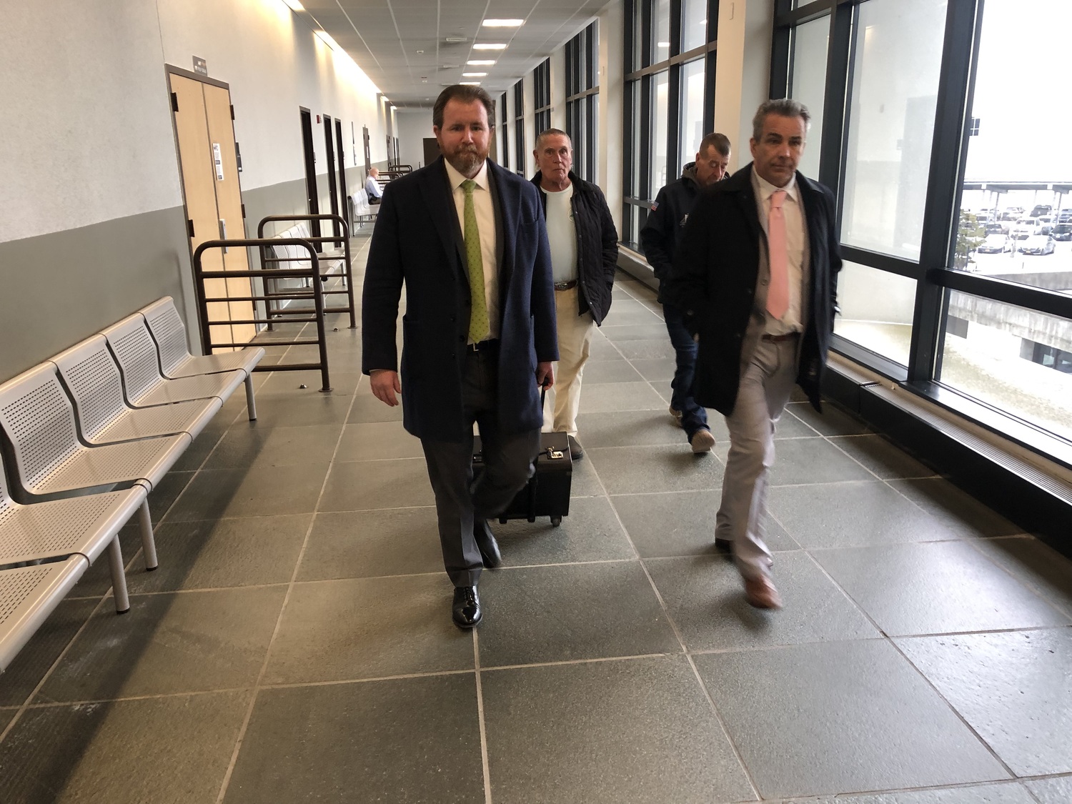 Raymond Bouderau, on the right, leaving the courtroom after pleading guilty on Thursday, January 18, to committing the September 25, 2022, burglary of a Sag Harbor residence. He will be sentenced to three and a half years incarceration early this spring. His attorney Jonathon Manley is on the left. T.E. McMORROW