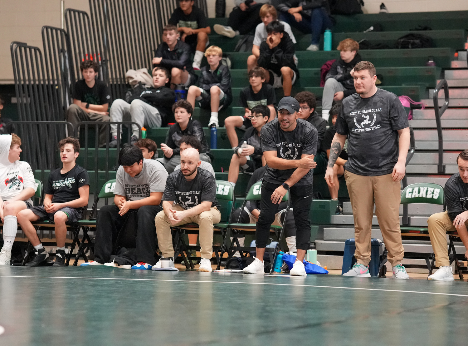 Jakob Restrepo and fellow coaches try and lead Sean Ryan during his match.   RON ESPOSITO