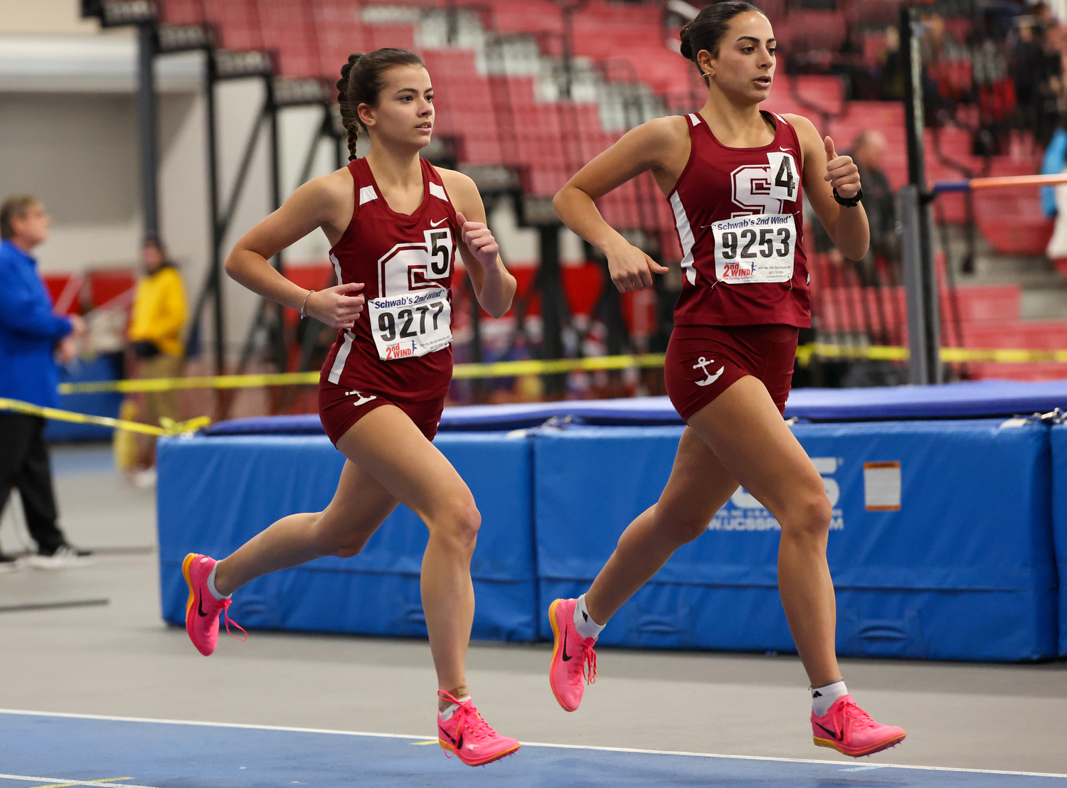 Mariners Emma Suhr, left, and Jeorgiana Gavalas running side by side in the 1,000-meter race.   RON ESPOSITO