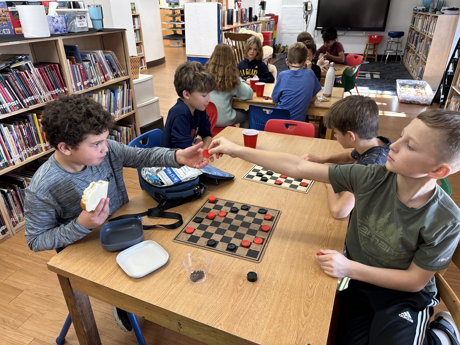 Sag Harbor Elementary students in grades  two through five participate in a checkers tournament during their lunch period. The game, which encourages strategic problem-solving, concentration and memory recall, and patience and persistence, has been a favorite among the students as they’ve played against their peers in a friendly and fun competition. COURTESY SAG HARBOR SCHOOL DISTRICT