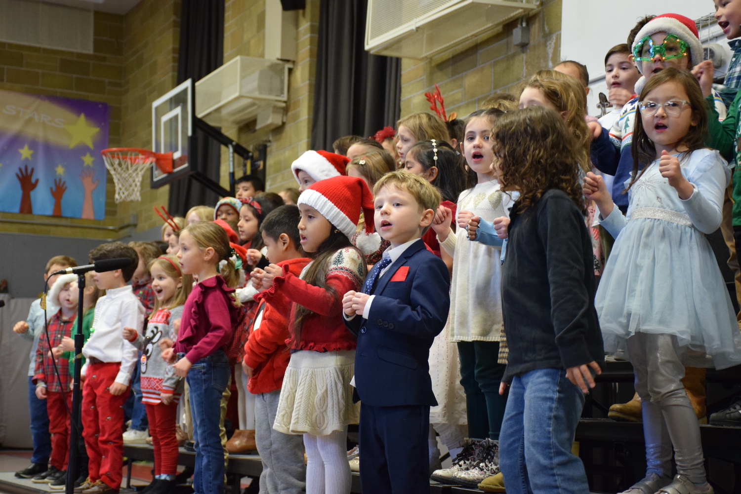 Sag Harbor Elementary School kindergartners performed their annual Holiday Sing at Morning Program. Lead by the elementary school’s music teacher, Deanna Locascio, the class sang several songs to share holiday cheer with their schoolmates and families. “ ‘Feliz Navidad’ was their favorite song to sing,” said Locascio. “Every time they would come into class, they would ask to sing it.” COURTESY SAG HARBOR SCHOOL DISTRICT