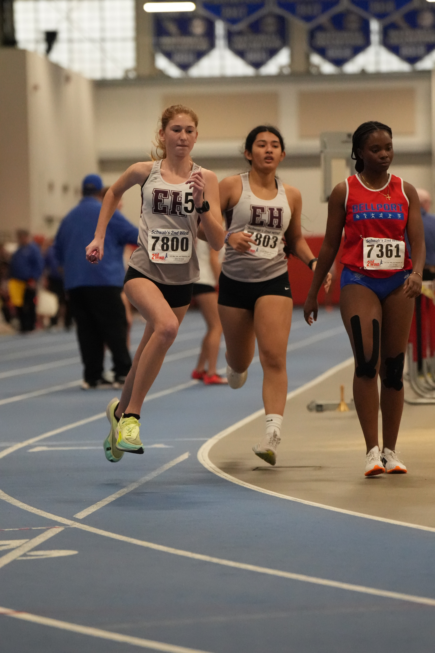 Sara O'Brien takes off after taking the baton from teammate Sam Ruano in the 4x200-meter relay.  RON ESPOSITO