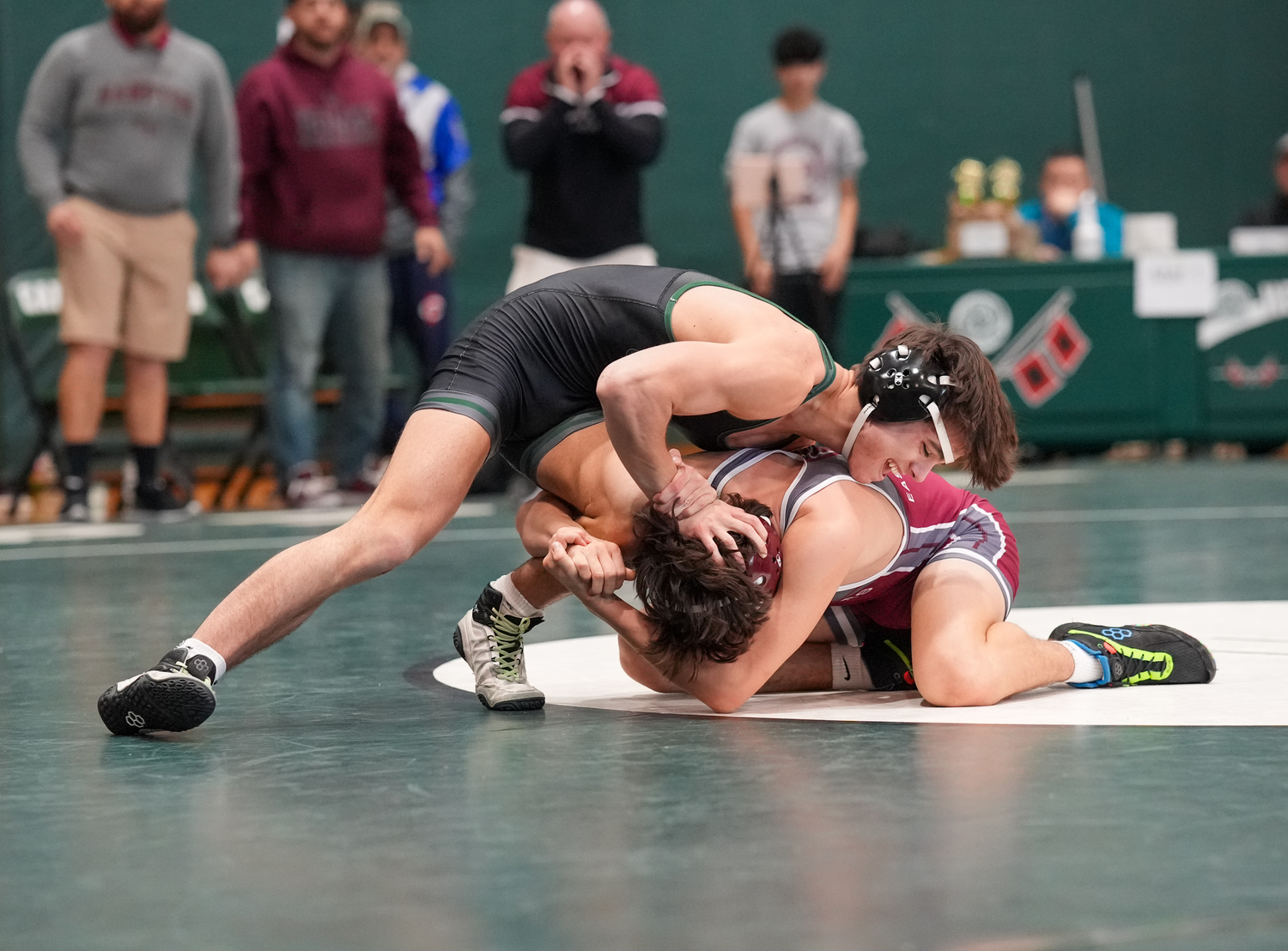 Sean Ryan pushes down on the head of Anthony Petersohn to try and escape his grip.   RON ESPOSITO