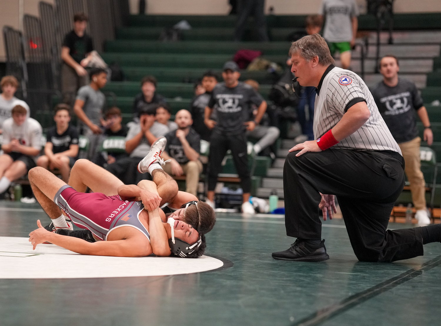 Tadgh Green works on pinning his opponent.   RON ESPOSITO