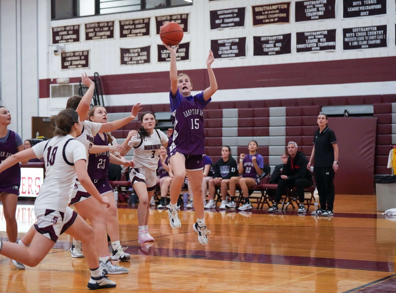 Hampton Bays sophomore Taylor Meyers shoots underneath the basket.  RON ESPOSITO/SOUTHAMPTON SCHOOL DSITRICT