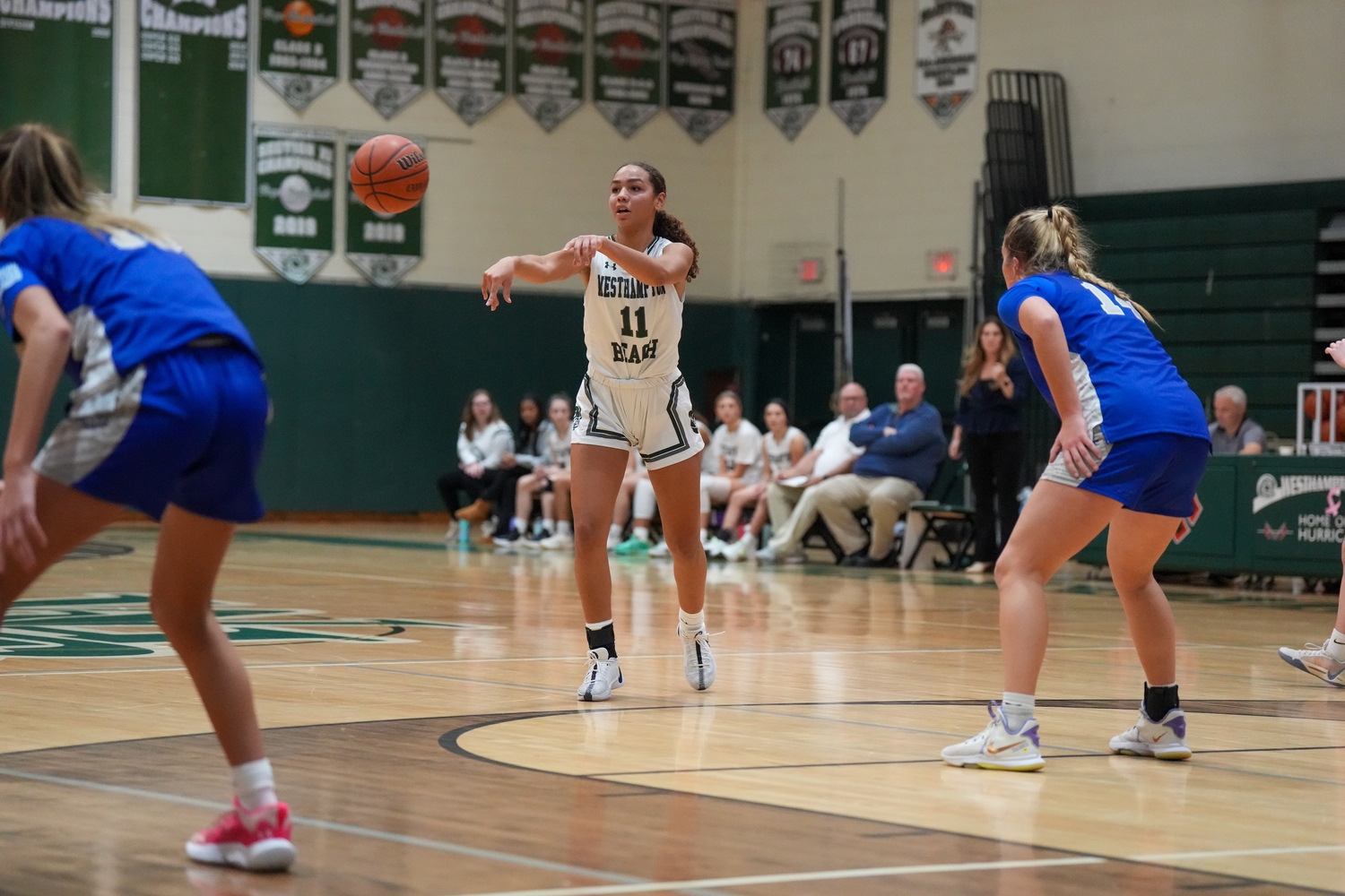 Sophomore center Jasmine Taylor, passing the ball outside in her first game back from injury, scored eight points in the win over Hauppauge. RON ESPOSITO