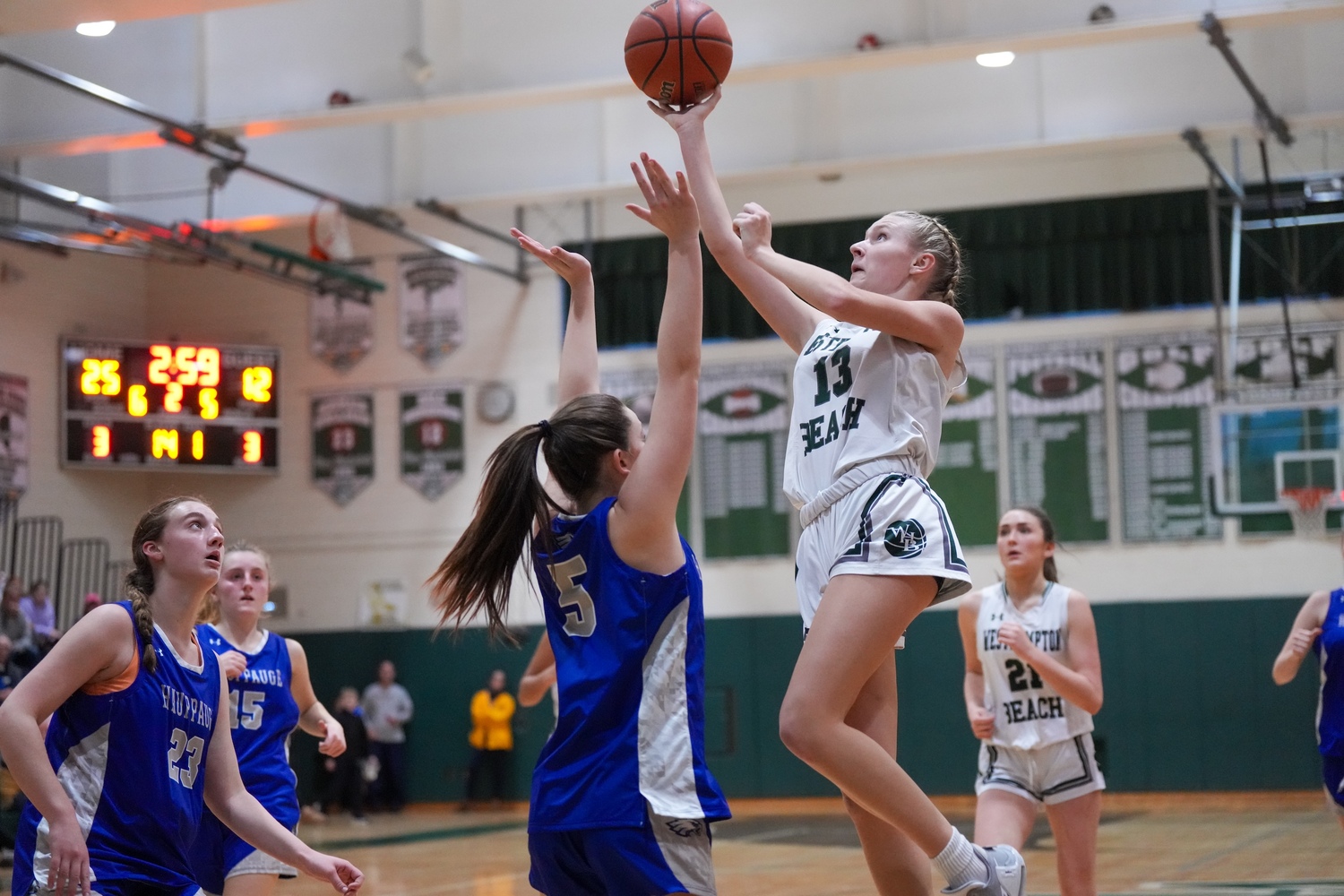 Freshman guard Kate Sweet leaps up to the basket. RON ESPOSITO