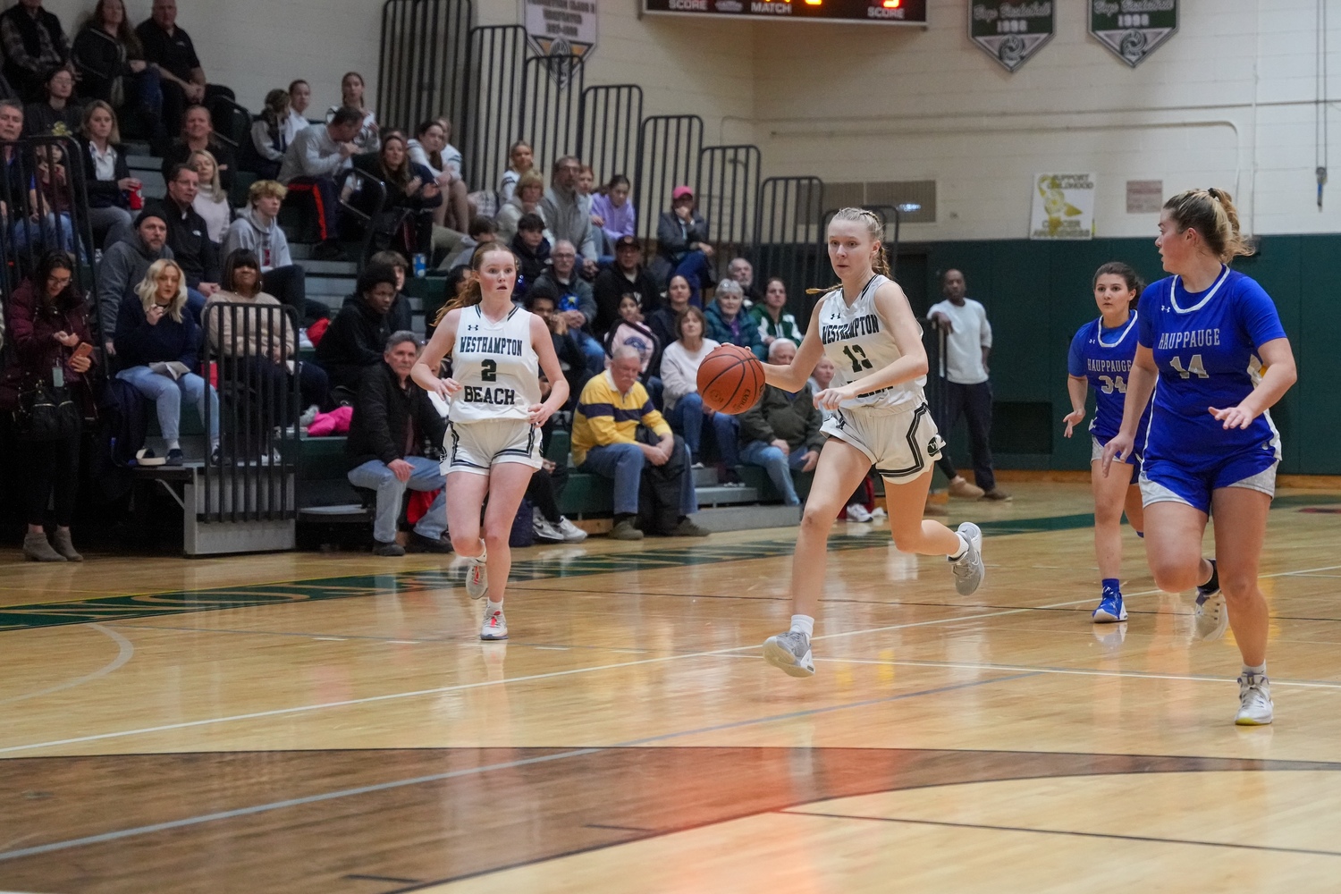 Freshman guard Kate Sweet carries the ball down the court. RON ESPOSITO