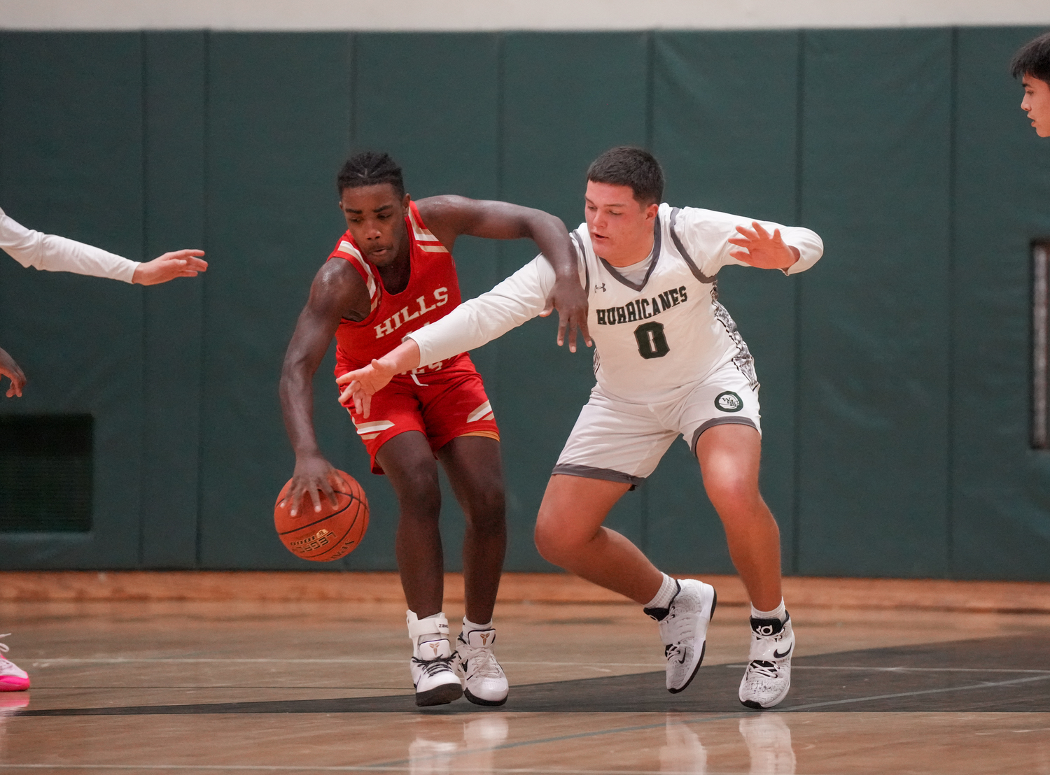 Senior power forward Andrew Mensch attempts to steal the ball in a game against Half Hollow Hills West January 11. RON ESPOSITO