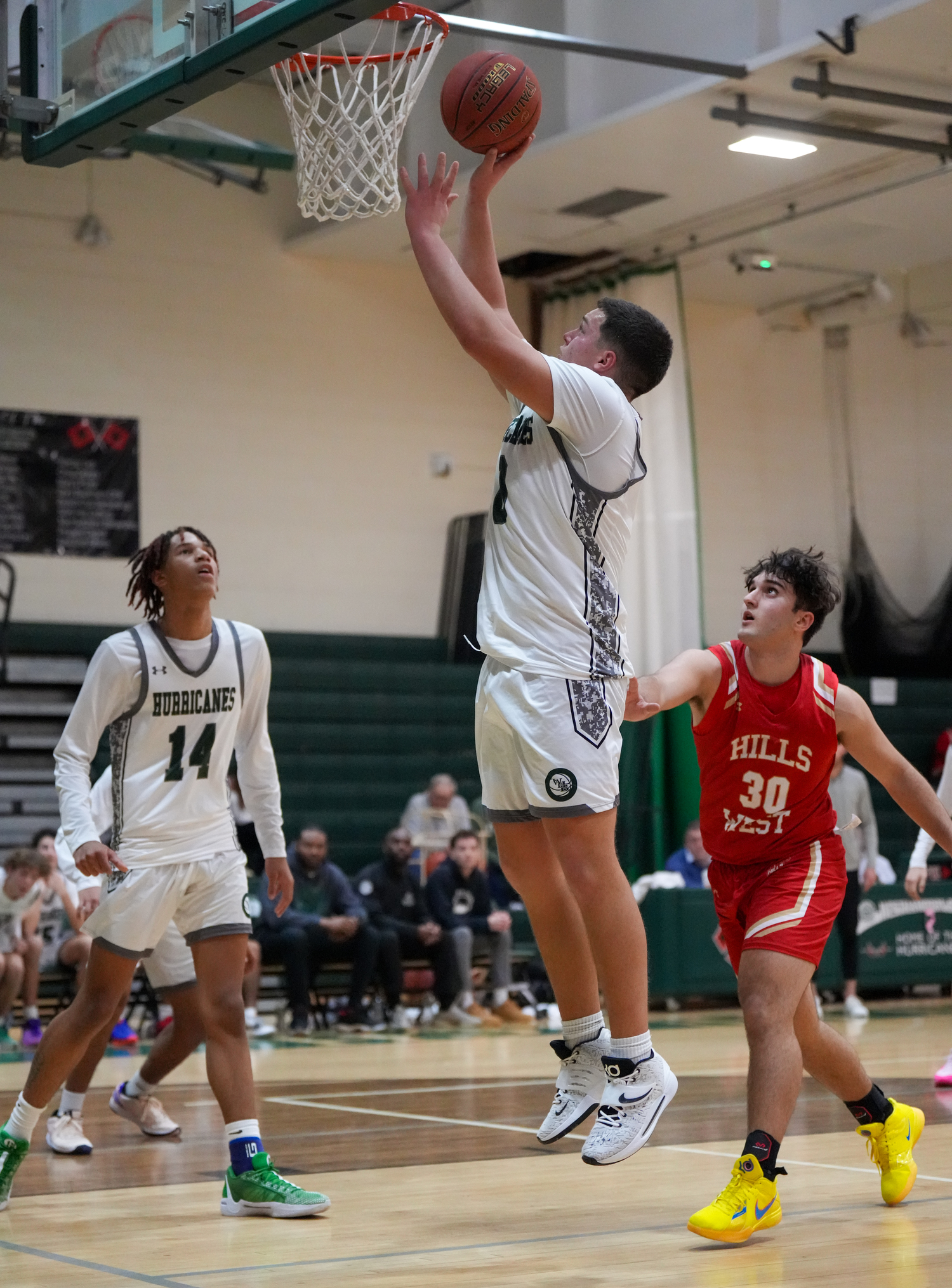 Senior power forward Andrew Mensch shoots in a game against Half Hollow Hills West January 11. RON ESPOSITO