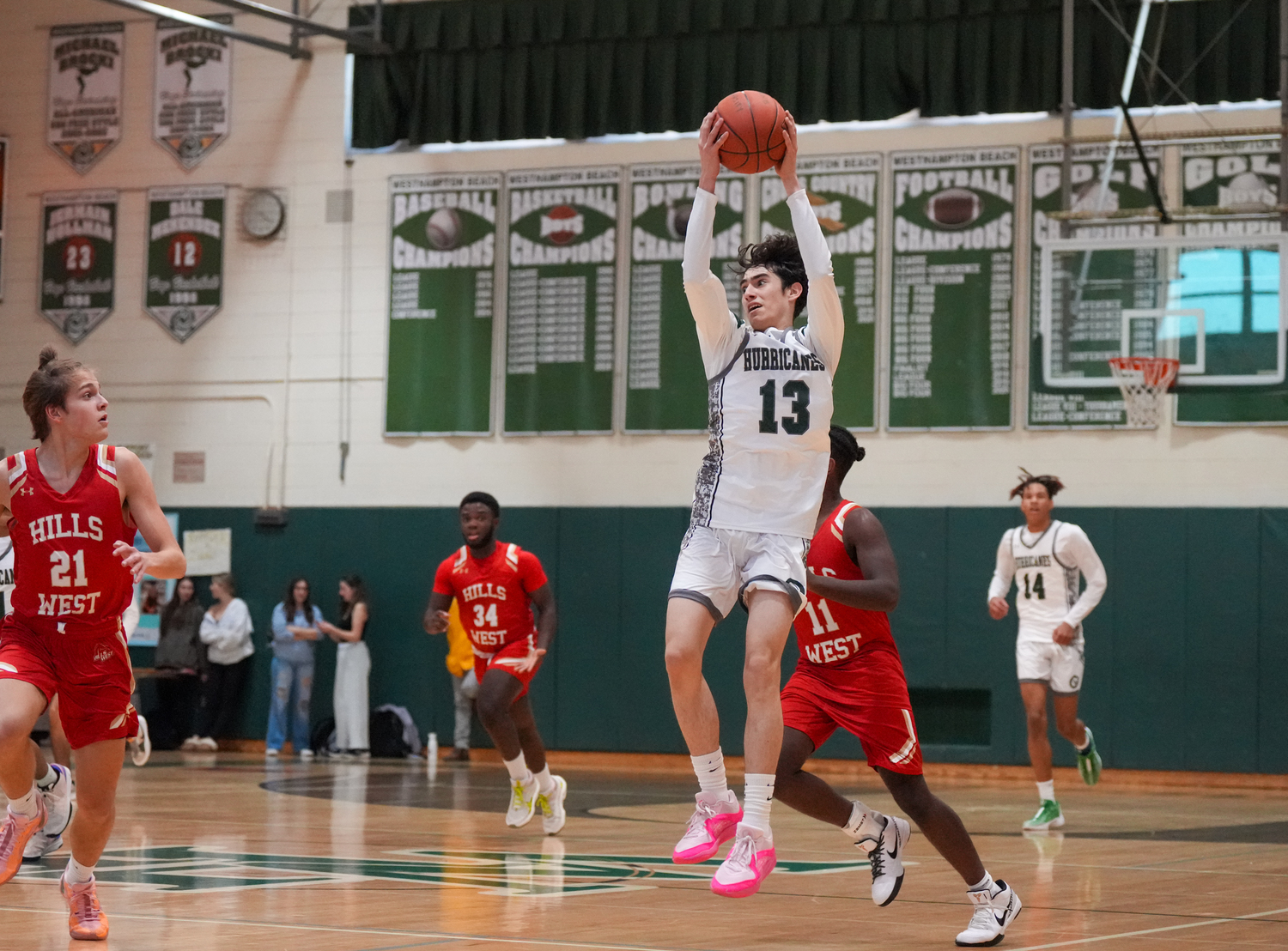 Junior guard Dante Quinones jumps for the ball in a game against Half Hollow Hills West January 11. RON ESPOSITO