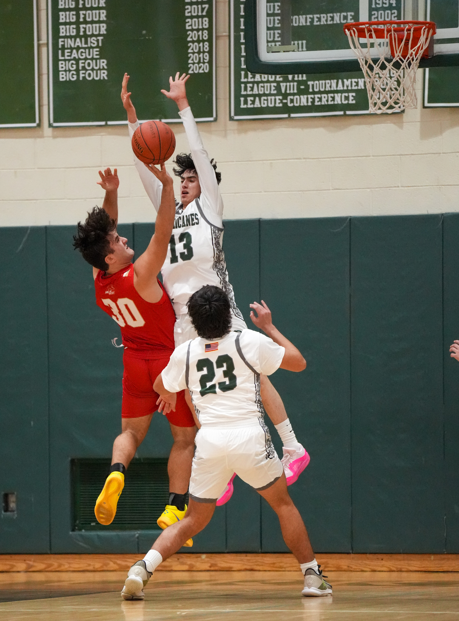 Junior guard Dante Quinones leaps up for a block in a game against Half Hollow Hills West January 11. RON ESPOSITO
