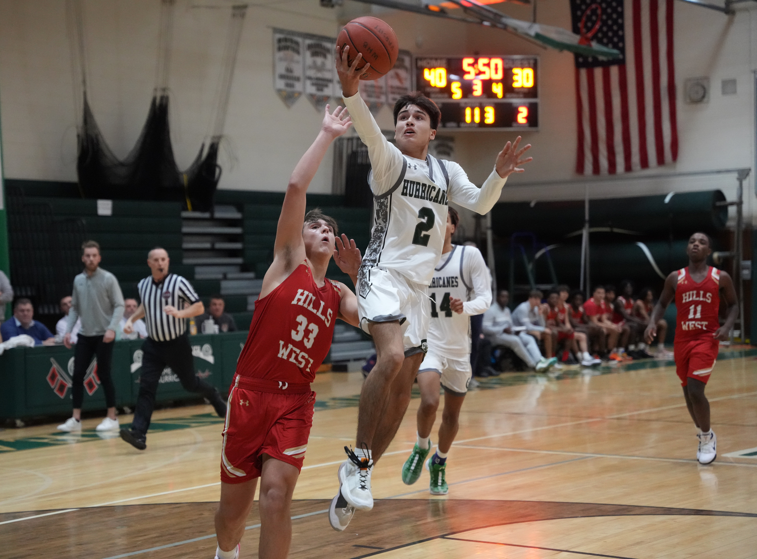 Senior guard Isaiah Ortiz reaches for the hoop in a game against Half Hollow Hills West January 11. RON ESPOSITO