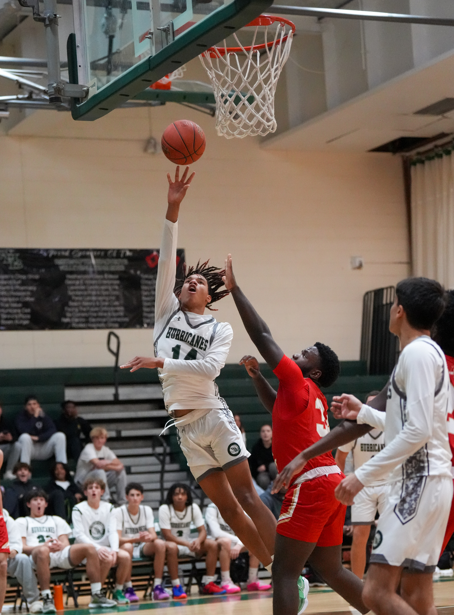 Junior center Jorden Bennett hit a layup in a game against Half Hollow Hills West January 11. RON ESPOSITO