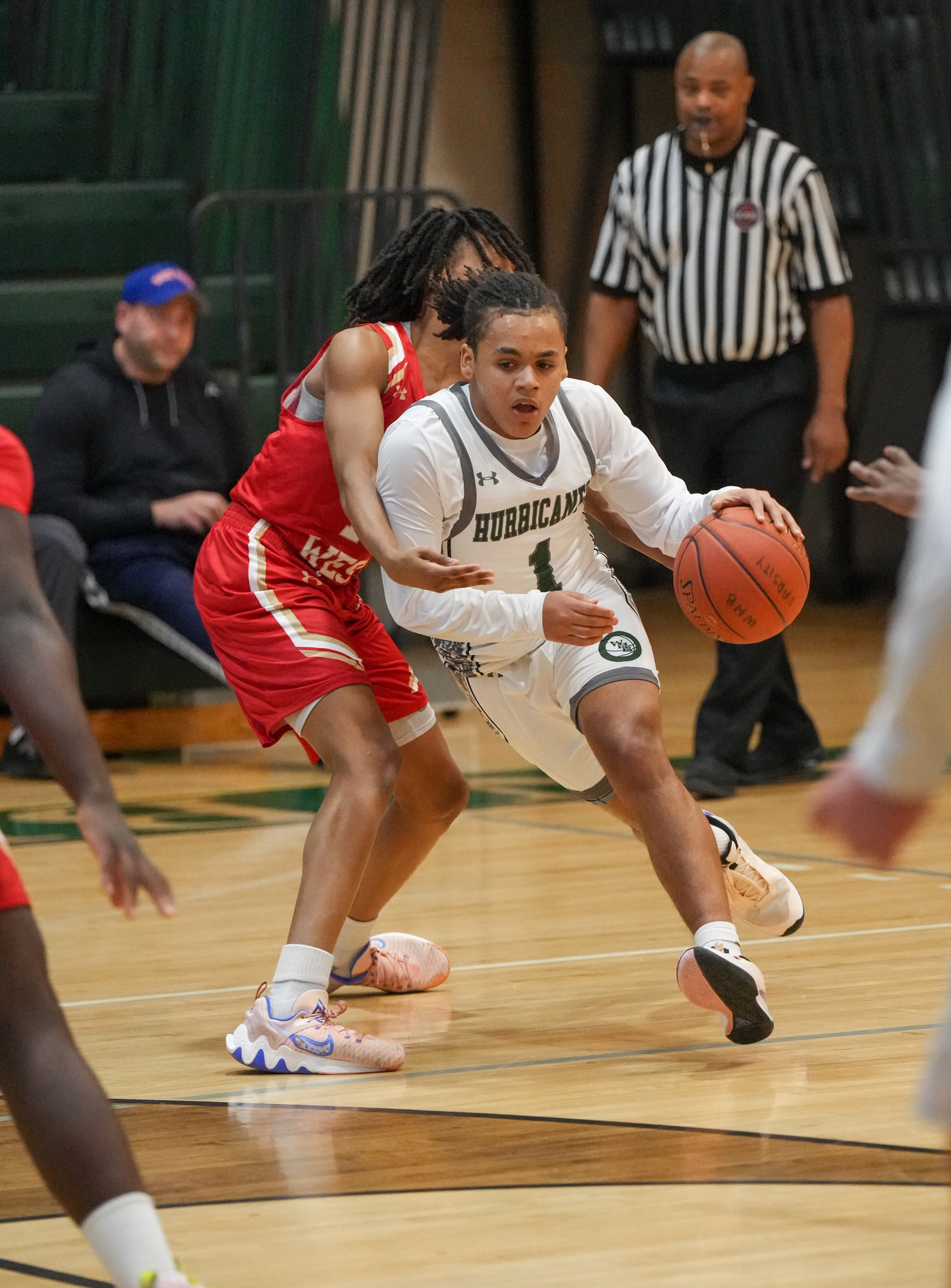 Sophomore point guard Malachi Bullock race around a defender in a game against Half Hollow Hills West January 11. RON ESPOSITO