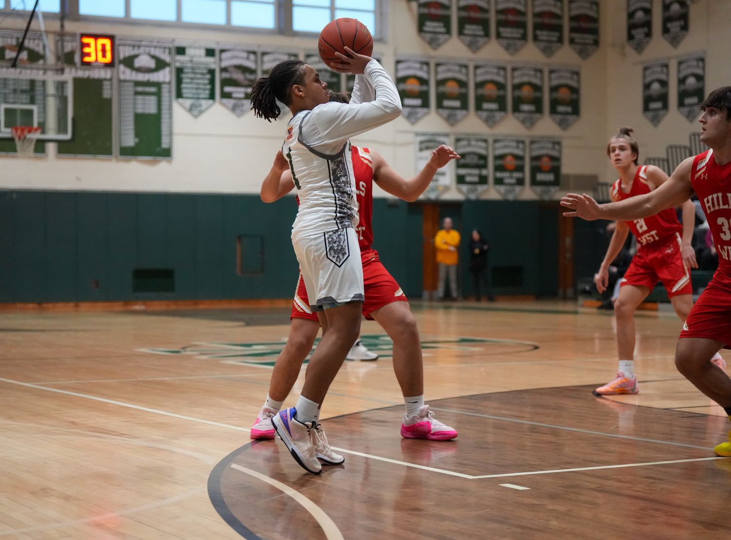Sophomore point guard Malachi Bullock shoots in a game against Half Hollow Hills West January 11. RON ESPOSITO