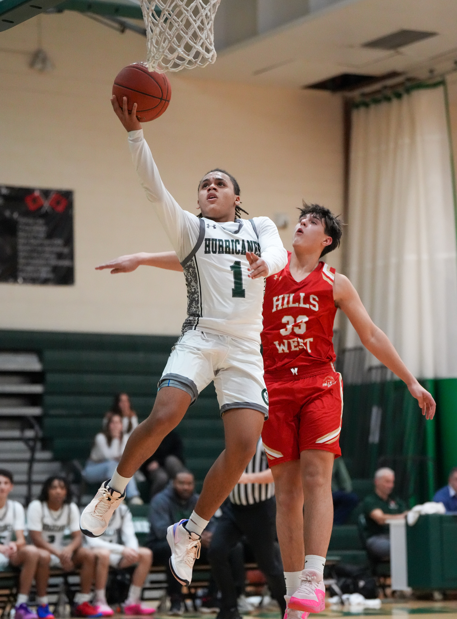 Sophomore point guard Malachi Bullock reaches for the rim in a game against Half Hollow Hills West January 11. RON ESPOSITO