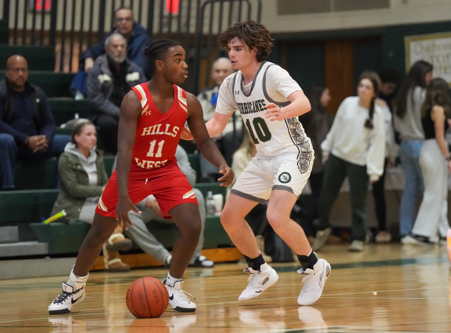 Sophomore point guard Truman Hahn on defense in a game against Half Hollow Hills West January 11. RON ESPOSITO