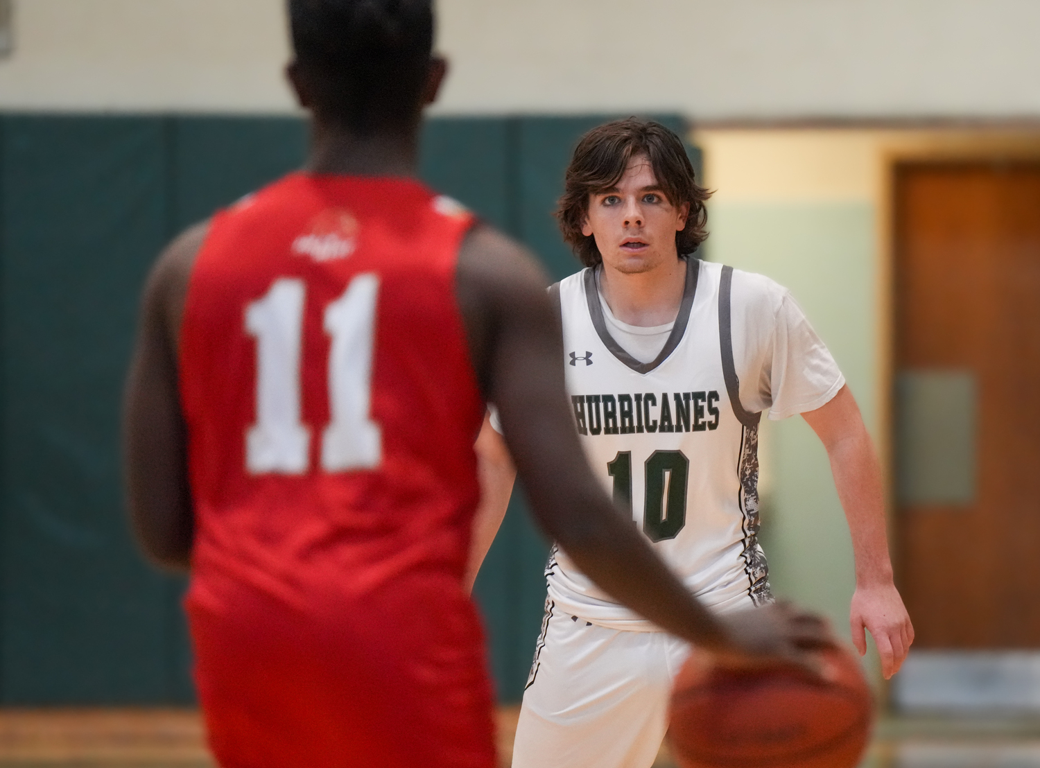 Sophomore point guard Truman Hahn keeps his eyes on an opponent in a game against Half Hollow Hills West January 11. RON ESPOSITO