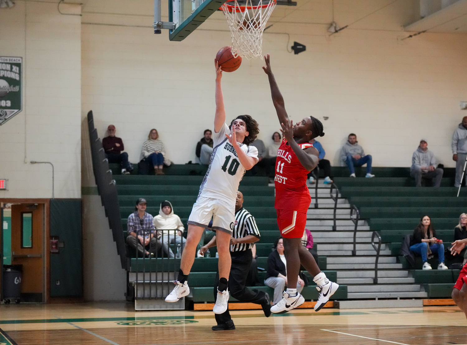 Sophomore point guard Truman Hahn breaks to the basket in a game against Half Hollow Hills West January 11. RON ESPOSITO