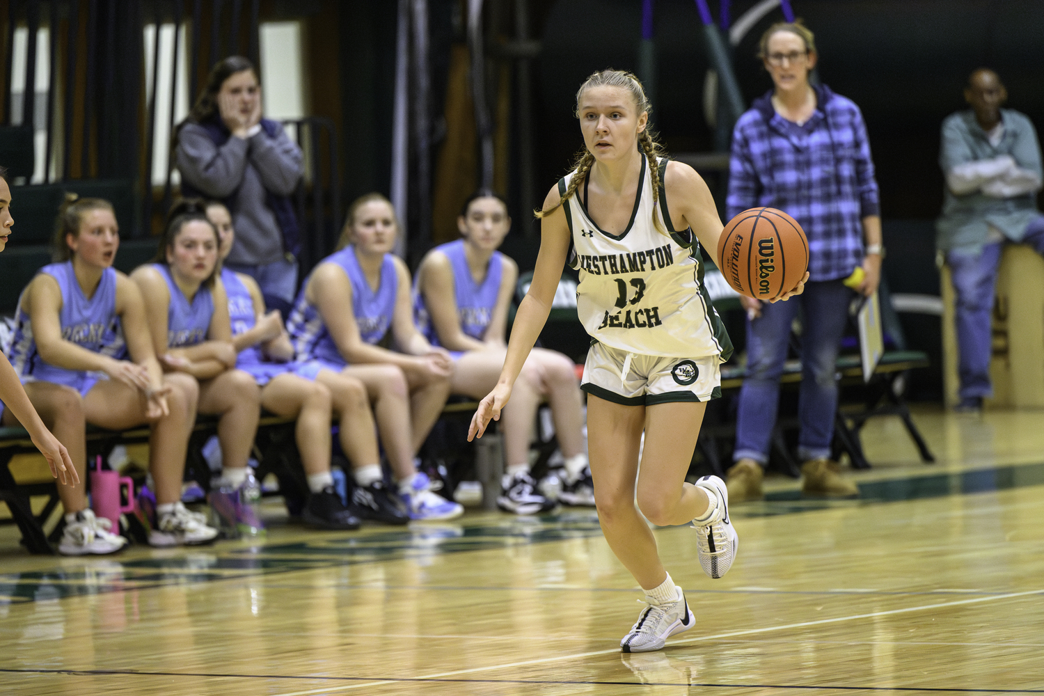 Freshman guard Kate Sweet carries the ball down the court. MARIANNE BARNETT