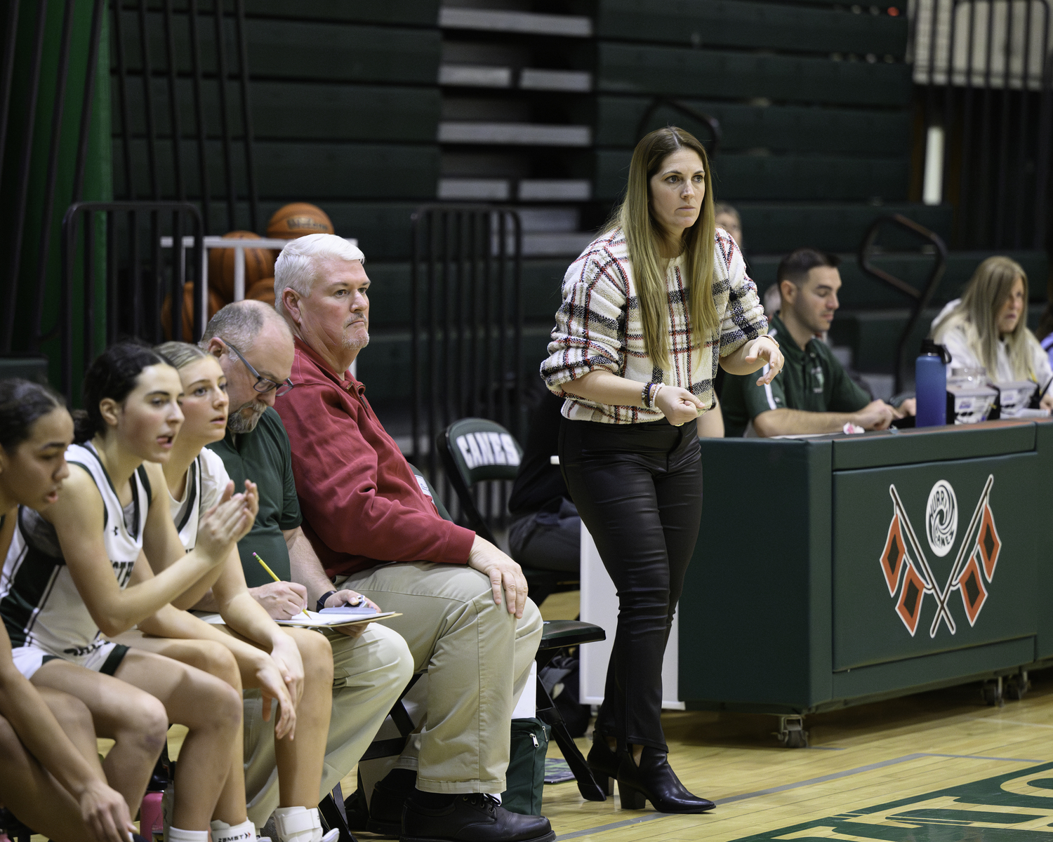Head coach Katie Peters watches her team follow the play call. MARIANNE BARNETT