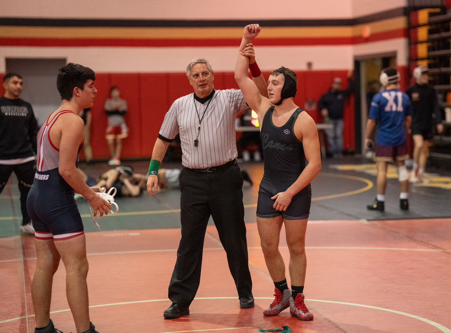 Aidan Caruana gets his arm raised after a victory.  RON ESPOSITO