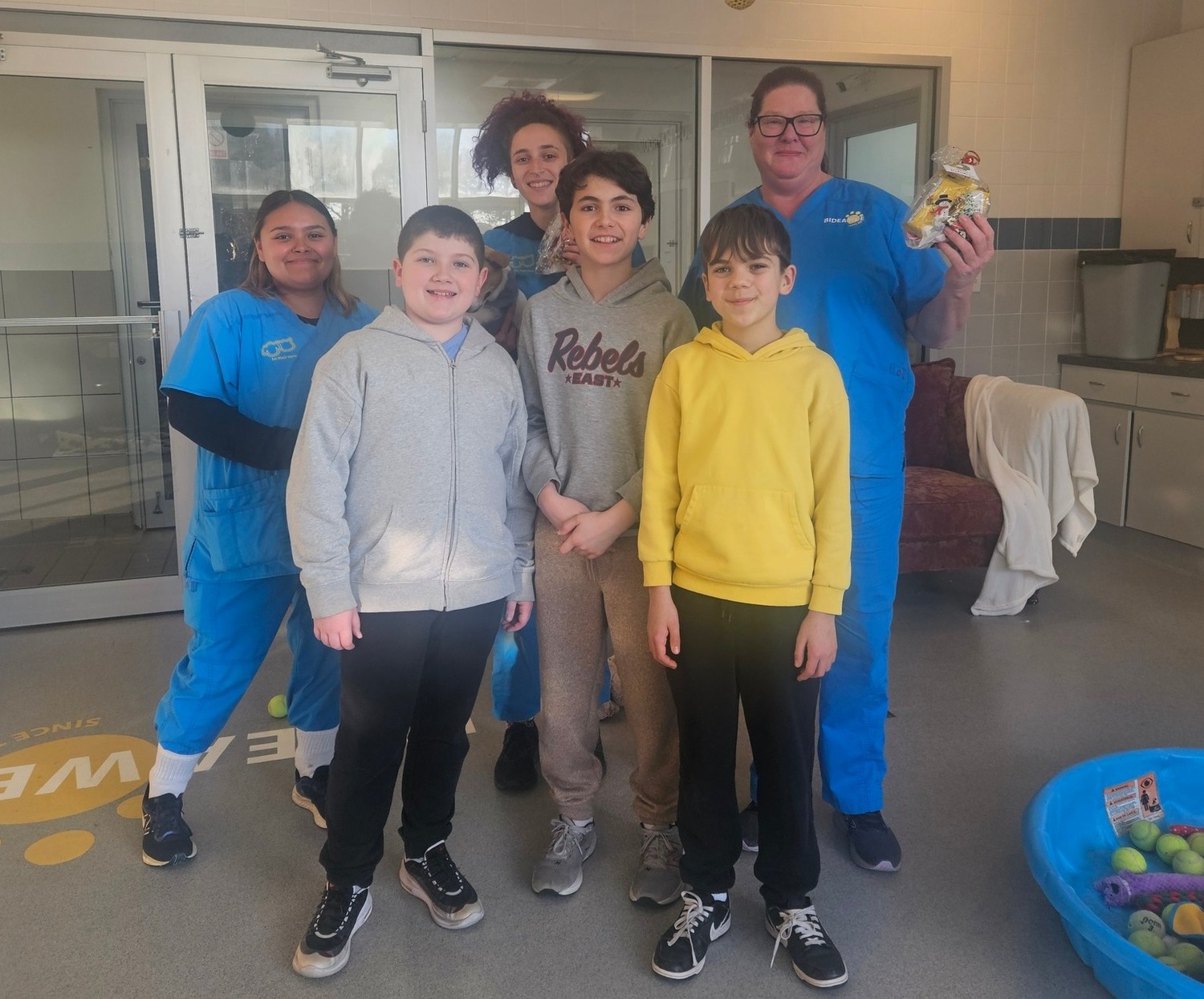 Members of the Westhampton Beach Middle School Kiwanis Builders Club, from left, Gage Matlock, Leo Bonawandt, and Evan Pereyra, with staff at Bideawee, recently dropped off a donation of holiday gift bags at Bideawee. COURTESY WESTHAMPTON KIWANIS