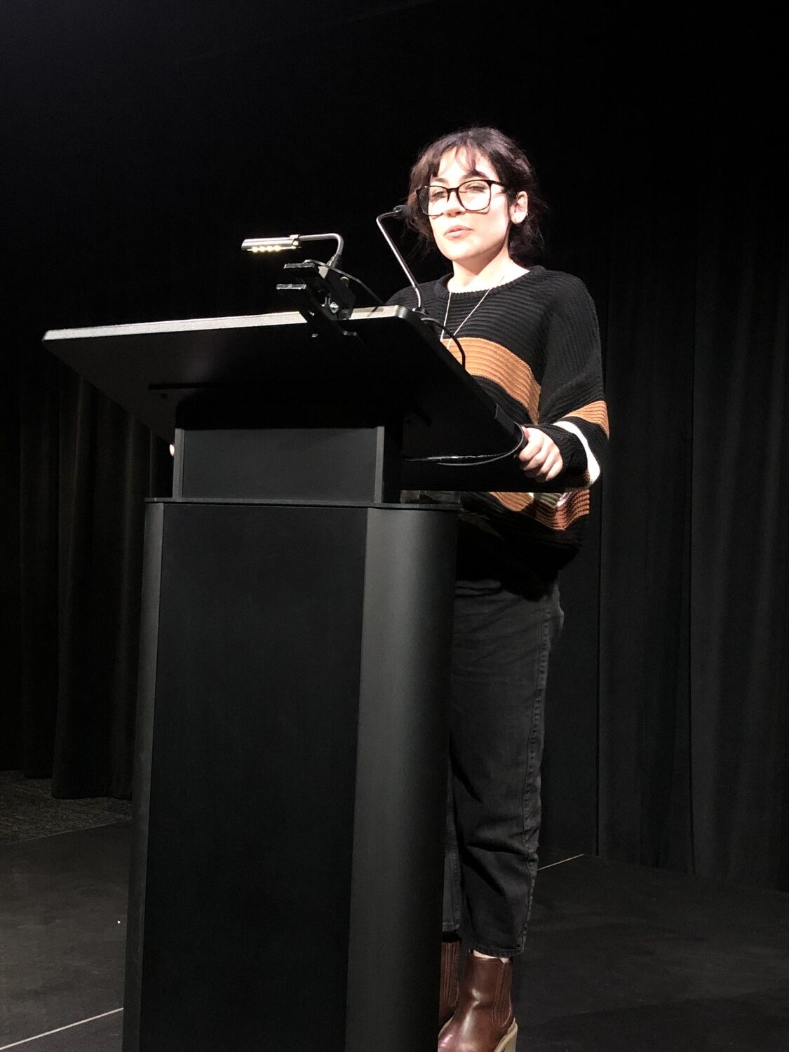 Student Eva McCarthy Minguez at an MFA student and faculty reading. COURTESY LICHTENSTEIN CENTER FOR THE ARTS
