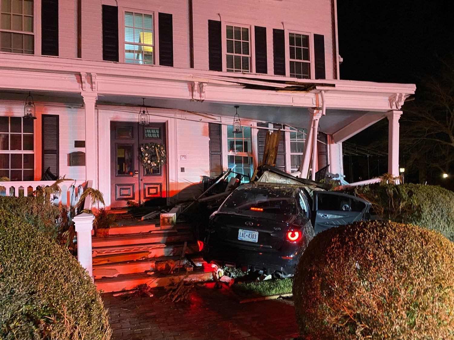 A car carrying four people crashed into the Hedges Inn in East Hampton Village early Monday morning. Police said the vehicle, carrying four teenagers from up-Island, was fleeing from police at a high rate of speed down Woods Lane before skidding across the grassy and James Lane and crashing into the building. MARCOS BALADRON