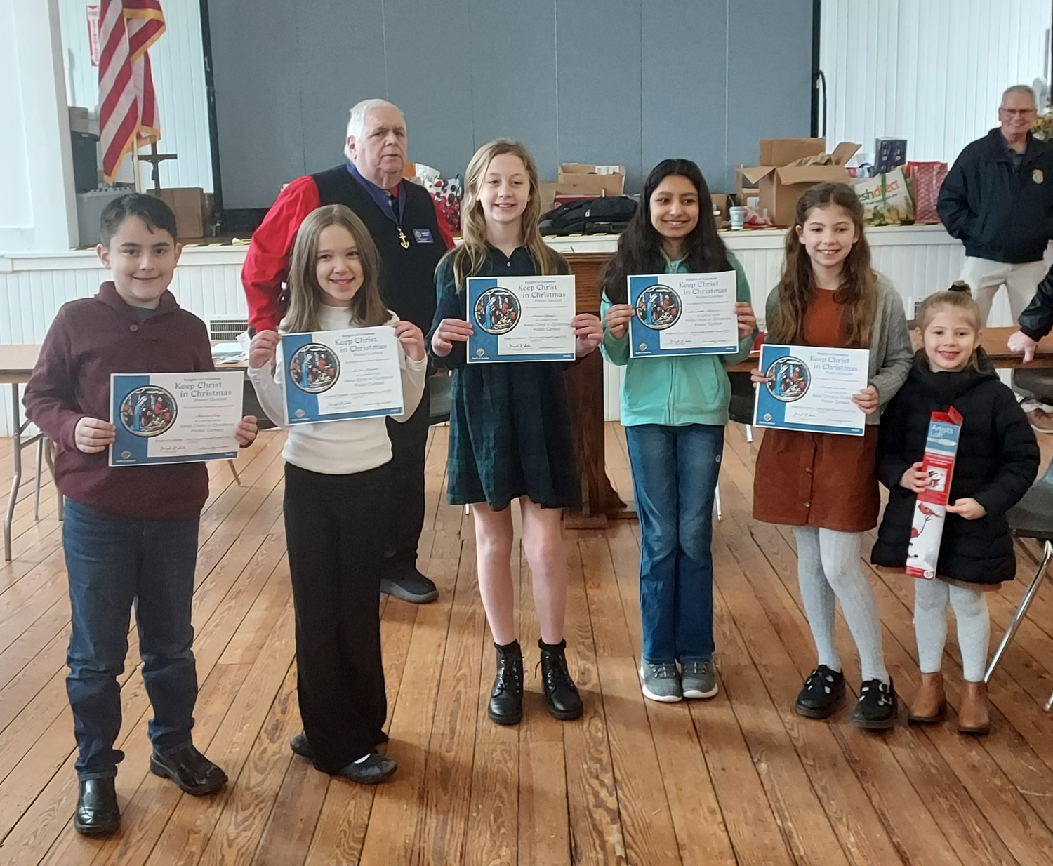 The Knights of Columbus Joseph Slomski Council #7423 of Immaculate Conception Church in Westhampton Beach held a reception for the finalists of its annual “Keep Christ in Christmas” poster contest. The winners, selected in three age groups, were kindergarten through second grade, Abigail Veglucci; third through fifth grade, Ponette Lawston; and sixth through eighth grade Winter Grace Hinck.  From left, some of the competitors Gabriel Diaz, Amber Gearity, Avery Coleman, Annabelle Feliciano and Ponette Lawston, along with Grand Knight Joe Sala. COURTESY KNIGHTS OF COLUMBUS