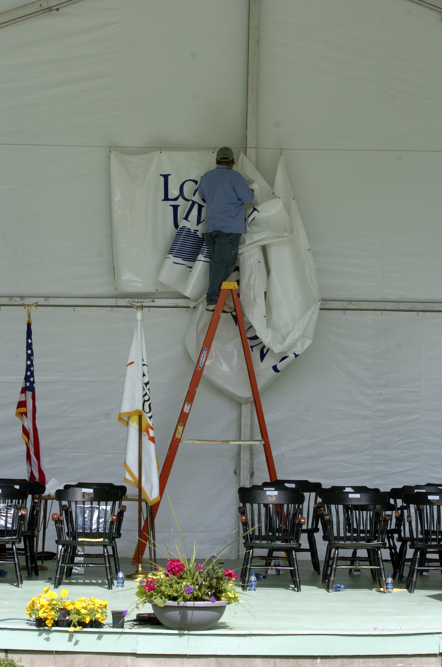 The banner is taken down at the last graduating class of Southampton College in May of 2005.  DANA SHAW