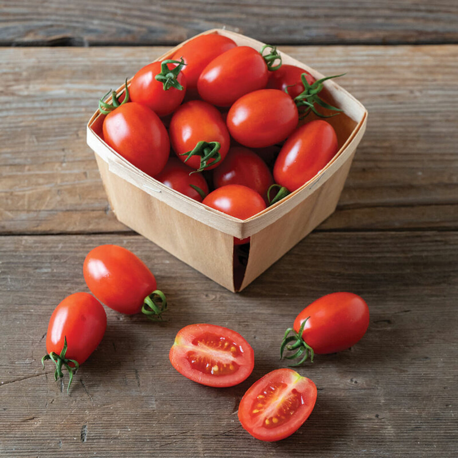 Candy Bell is a new grape type tomato from Johnny’s that is a determinate type rarely found in grape tomatoes. The downside against the indeterminate is that this with this variety all the fruits may ripen at the same time.