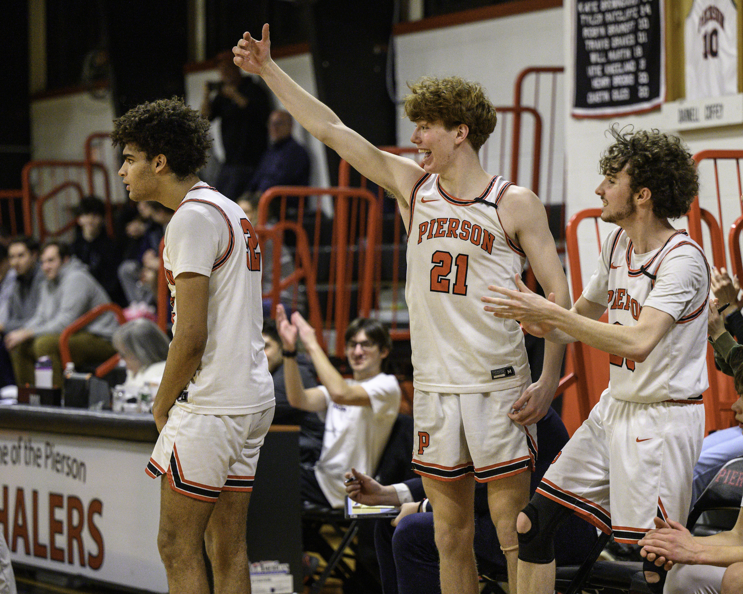 The Whalers celebrate another basket in their victory over Shoreham on Friday night.   MARIANNE BARNETT