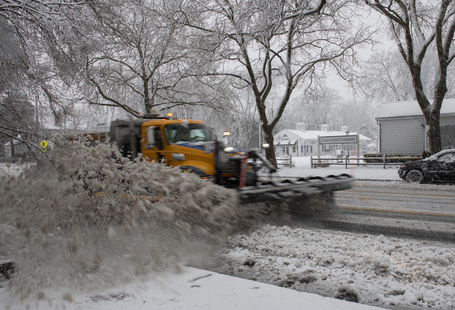 A plow goes through Amagansett Square on Tuesday.