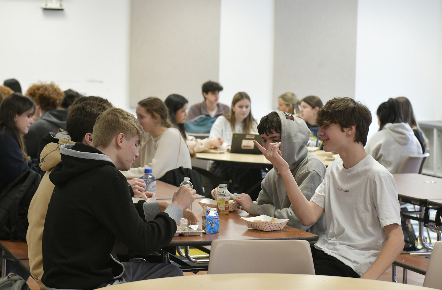 Students at Pierson High chat and enjoy their lunches instead of checking their phones.  DANA SHAW