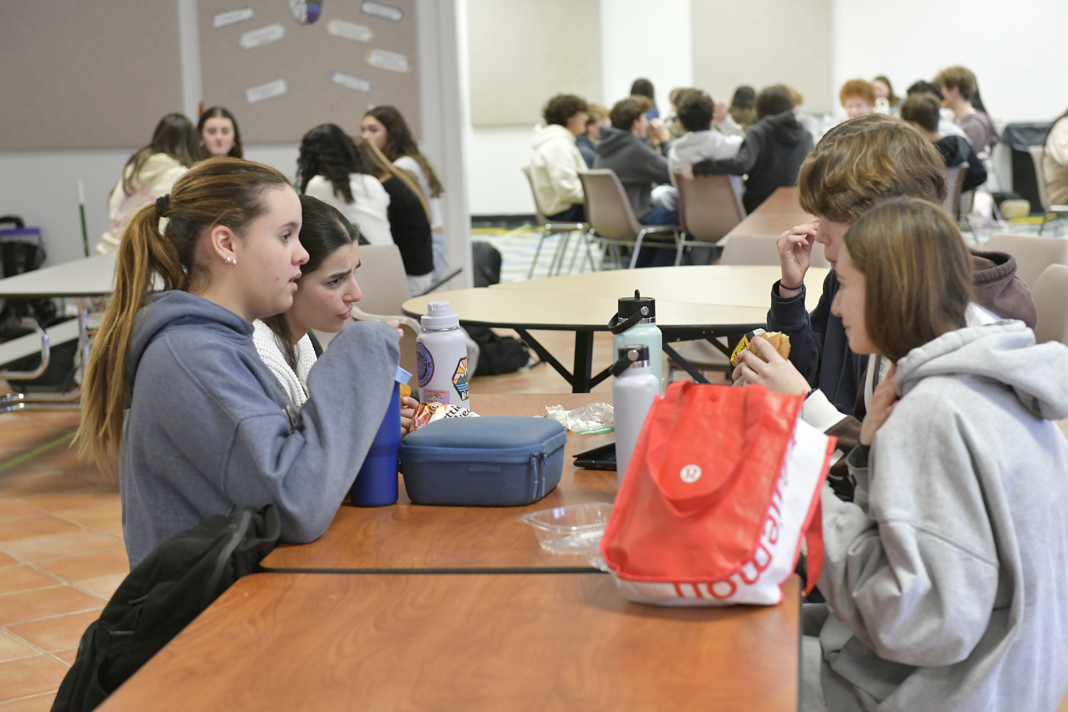 Students at Pierson High chat and enjoy their lunches instead of checking their phones.  DANA SHAW
